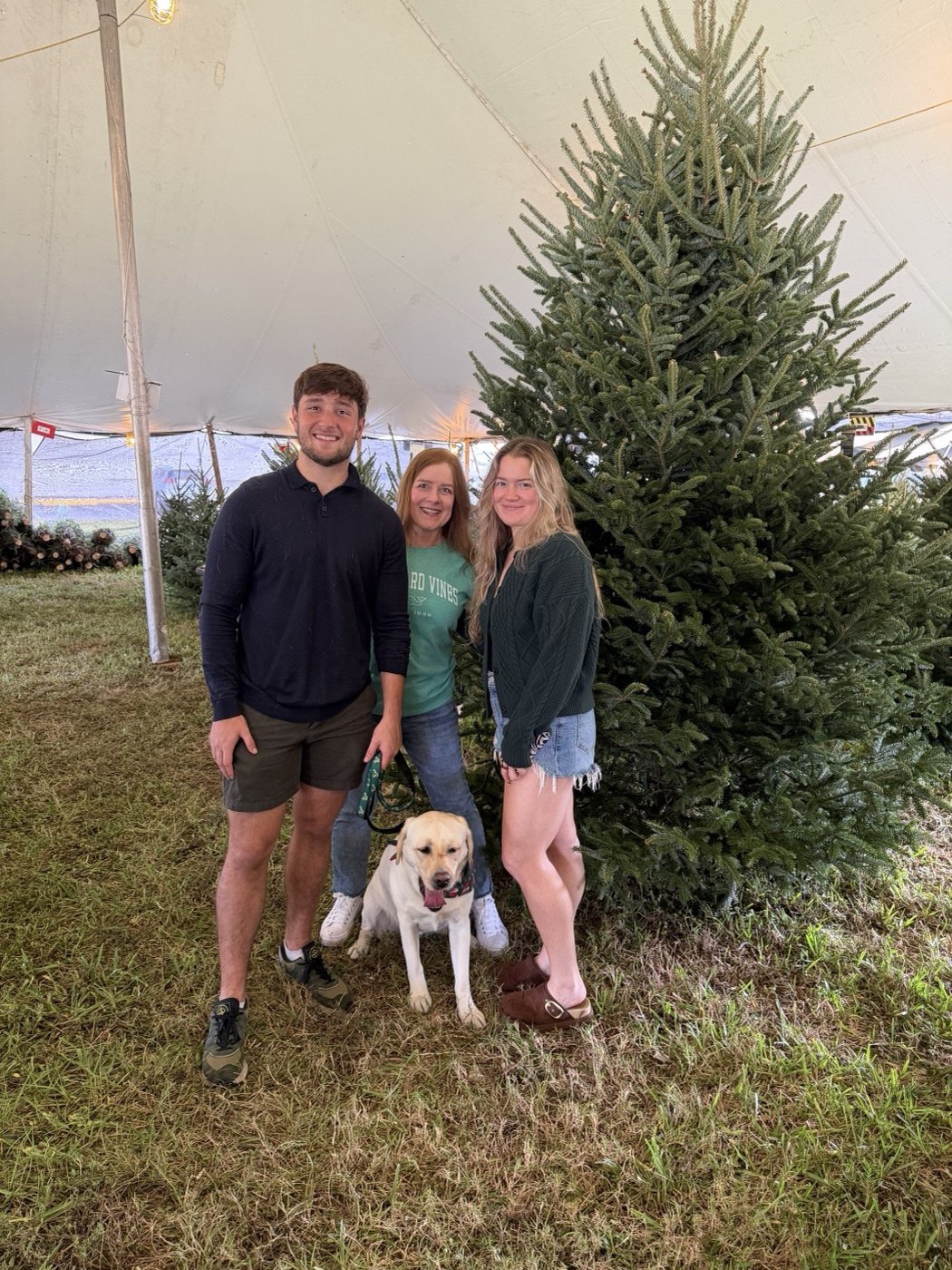 The Smith family at a Christmas tree farm with Aspen